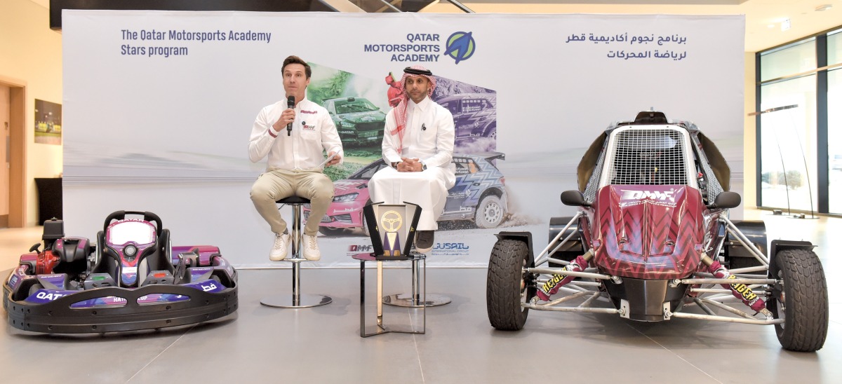 QMMF Executive Director Amro Al Hamad speaks alongside Program Consultant Nicolas Bernardi, a former French Rally champion and WRC driver, at the Lusail International Circuit.