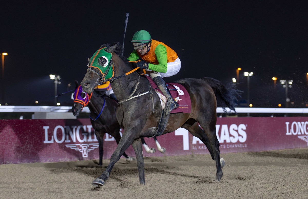 Jockey Jefferson Smith and Rammah compete in the feature race yesterday.