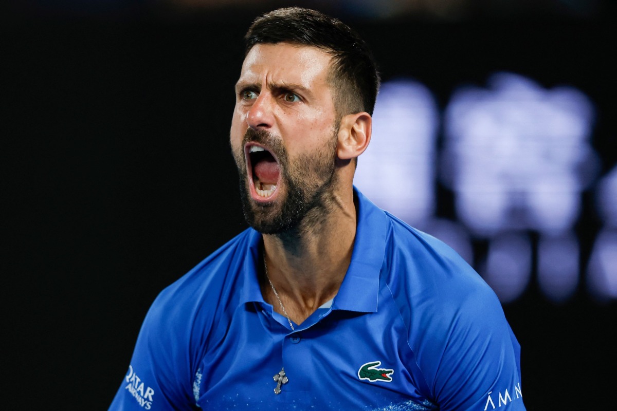 Serbia's Novak Djokovic reacts after a point against Czech Republic's Tomas Machac during their men's singles match on day six of the Australian Open tennis tournament in Melbourne on January 17, 2025. (Photo by Martin KEEP / AFP) 