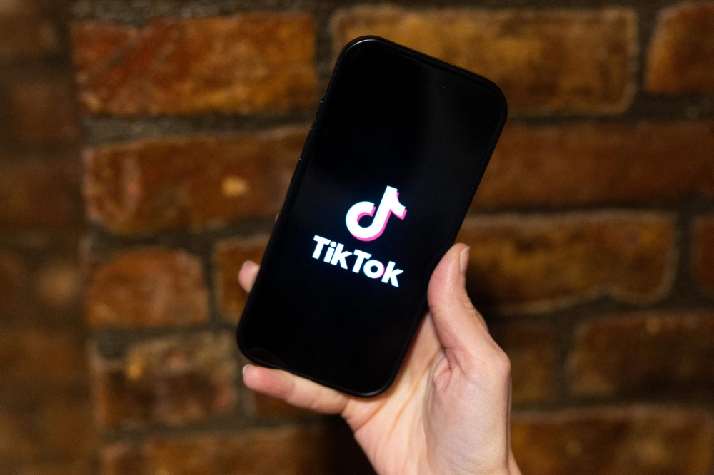 In this photo illustration, the TikTok logo is displayed on a phone on January 17, 2025 in New York City. Alex Kent/Getty Images/AFP 