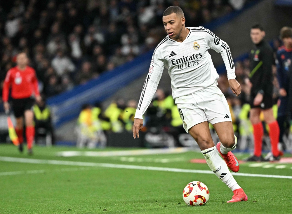 Real Madrid's French forward #09 Kylian Mbappe controls the ball during the Spanish Copa del Rey (King's Cup) last 16 first leg football match between Real Madrid CF and RC Celta de Vigo on January 16, 2025. (Photo by Javier Soriano / AFP)