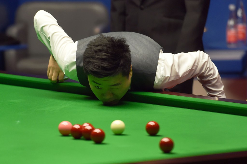 File photo: China's Ding Junhui contemplates a shot during the World Championship Snooker semi-final match against England's Mark Selby at The Crucible in Sheffield, England on April 28, 2017. AFP / PAUL ELLIS

