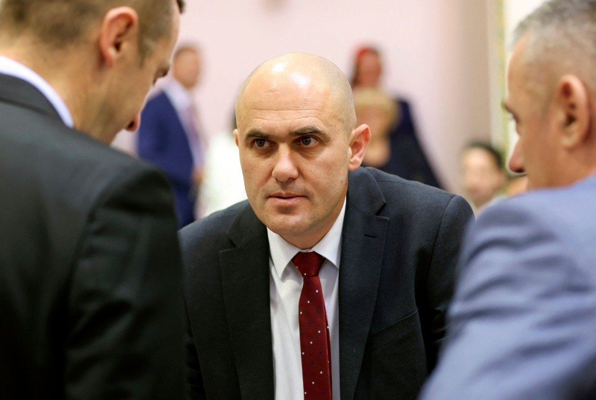 This photograph taken on May 15, 2024, shows then Croatian Minister of Agriculture, Forestry and Fisheries Josip Dabro (C) as he speaks with officials during a meeting in Zagreb. (Photo by DAMIR SENCAR / AFP)
