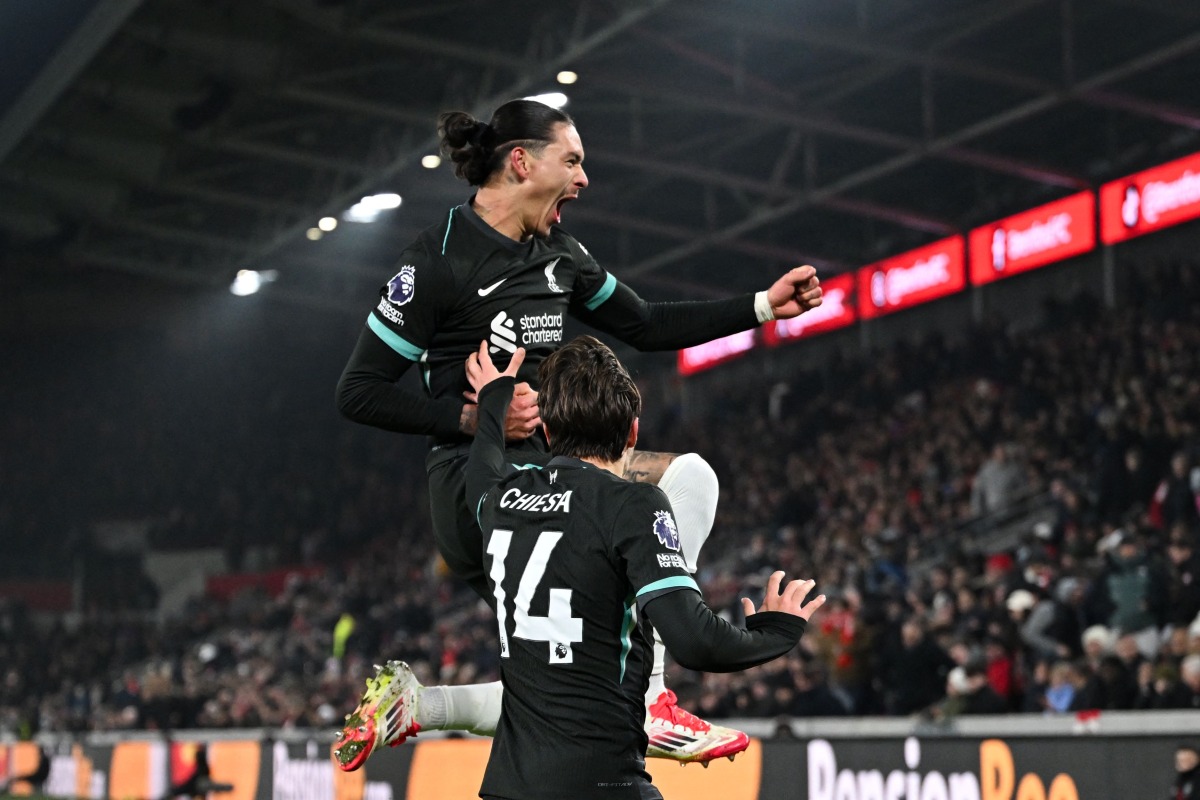 Liverpool's Uruguayan striker #09 Darwin Nunez celebrates after scoring his team second goal during the English Premier League football match between Brentford and Liverpool at the Gtech Community Stadium in London on January 18, 2025. (Photo by JUSTIN TALLIS / AFP)