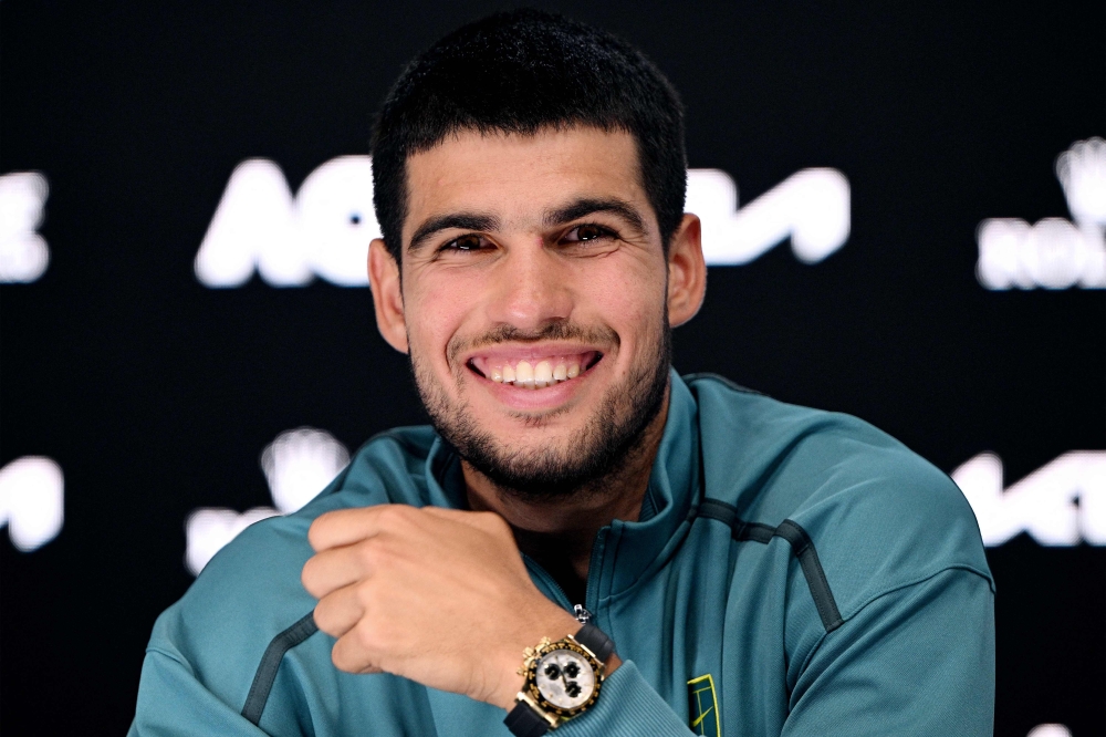 This handout picture released by the Tennis Australia on January 19, 2025 shows Spain's Carlos Alcaraz speaks at a press conference in Melbourne. (Photo by Vince Caligiuri / Tennis Australia / AFP) 