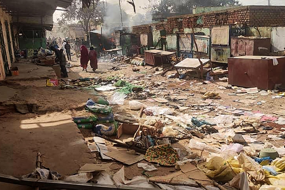 File photo for representational purposes only showing people walking among scattered objects in the market of El Geneina, the capital of West Darfur on April 29, 2023. (AFP)