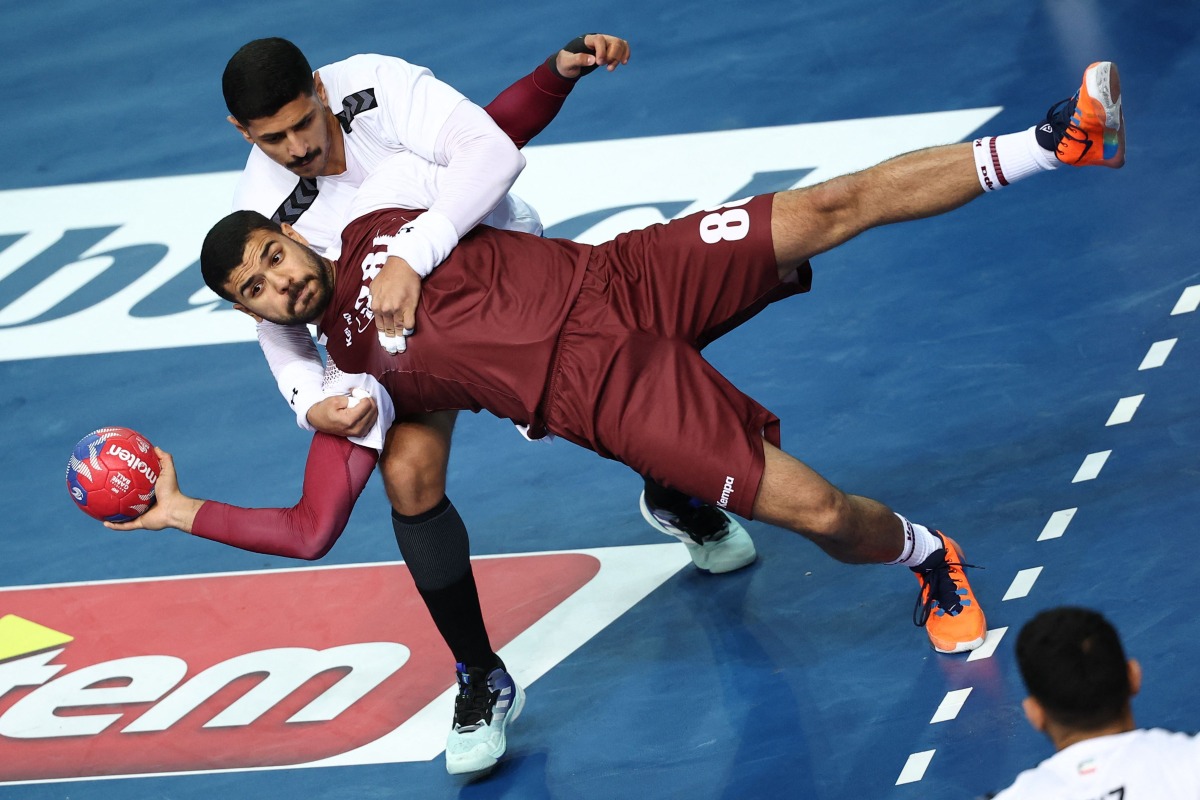 Qatar’s Moustafa Heiba prepares to shoot at the goal during the match against Kuwait.