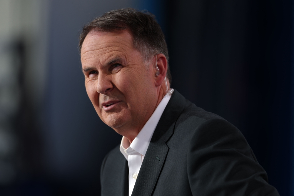 Australian TV sports presenter and journalist Tony Jones is seen on day nine of the Australian Open tennis tournament in Melbourne on January 20, 2025. (Photo by Martin Keep / AFP)