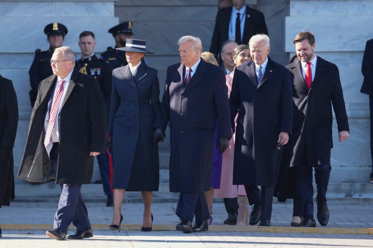 US President Donald Trump, First Lady Melania Trump, outgoing US President Joe Biden and first lady Dr. Jill Biden participate in the departure ceremony for the Bidens on the East Front of the United States Capitol in Washington, DC after the swearing-in of Donald Trump as President on January 20, 2025. (Photo by Chris KLEPONIS / POOL / AFP)
