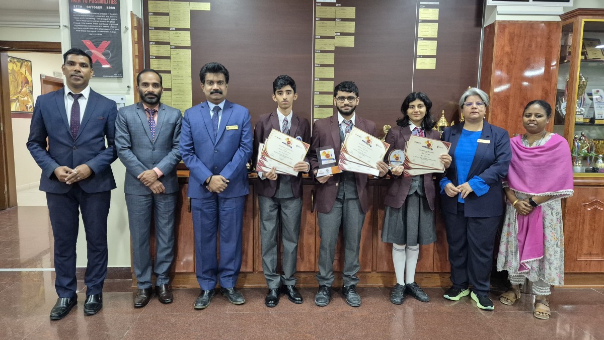 Principal, other officials and Birla Public School students with medals and certificates they received in the competition.