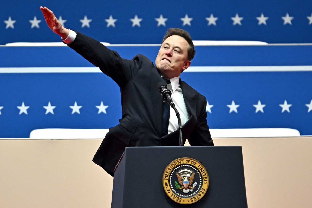 (FILES) Tesla and SpaceX CEO Elon Musk gestures as he speaks during the inaugural parade inside Capitol One Arena, in Washington, DC, on January 20, 2025. (Photo by ANGELA WEISS / AFP)
