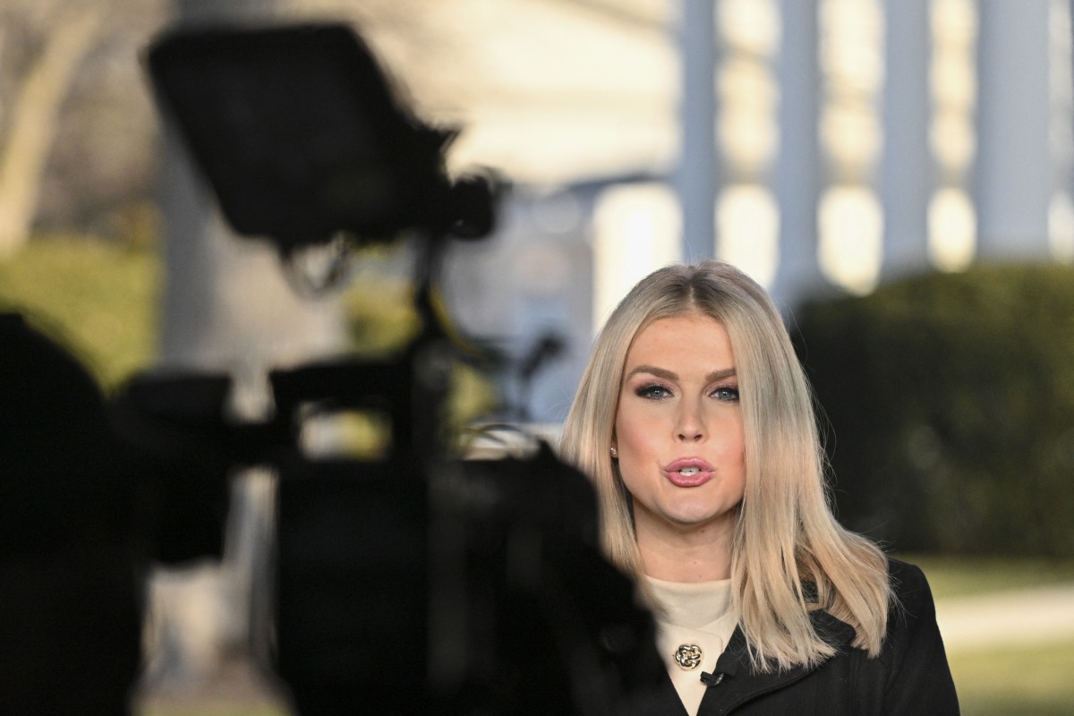 White House Press Secretary Karoline Leavitt speaks during an interview with a local network on the grounds of the White House in Washington, DC, on January 22, 2025. (Photo by Roberto Schmidt/ AFP)