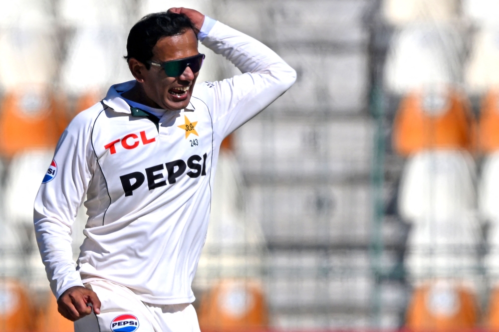 Pakistan's Noman Ali celebrates after taking the wicket of West Indies' Kemar Roach at the Multan Cricket Stadium on January 25, 2025. (Photo by Farooq Naeem / AFP)