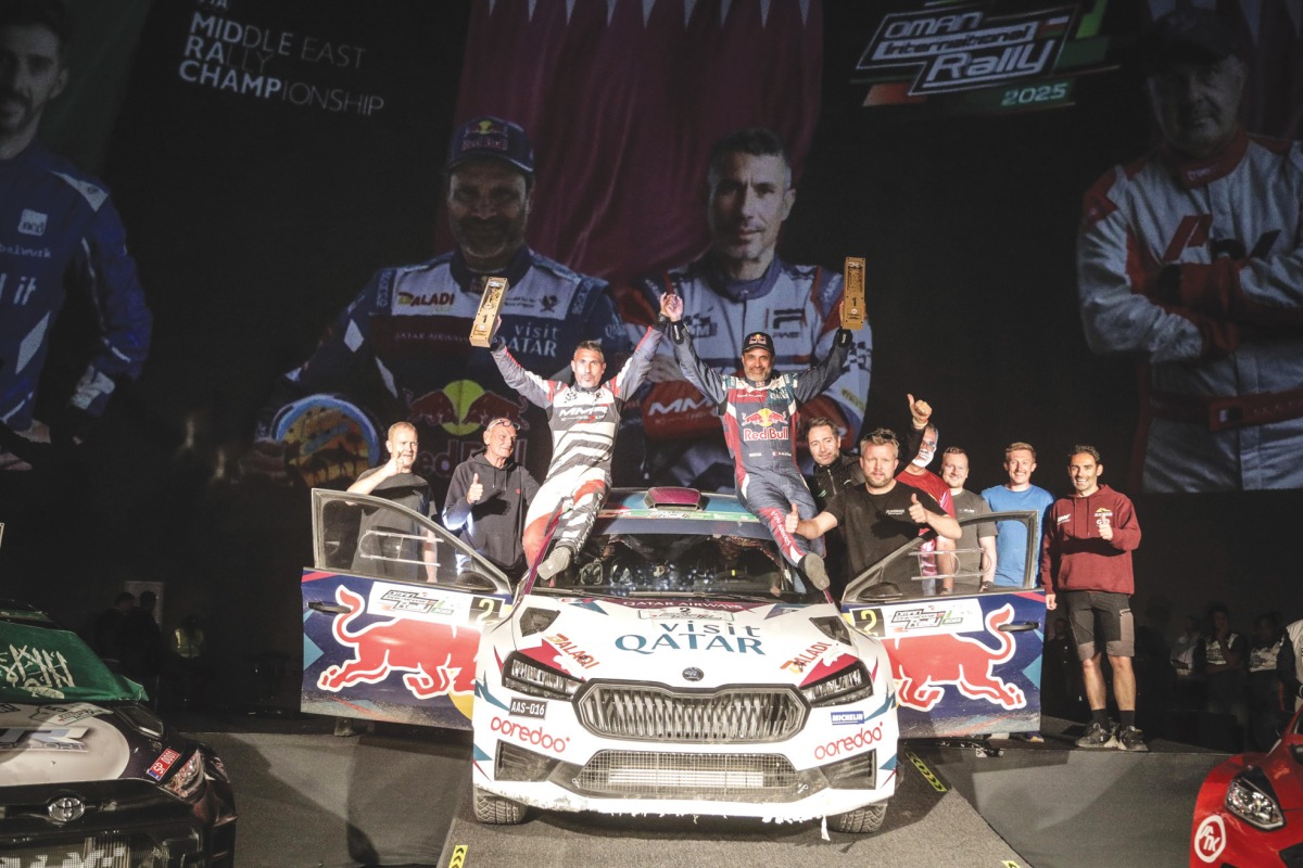 Nasser Saleh Al Attiyah and his co-driver Candido Carrera celebrate their victory. 