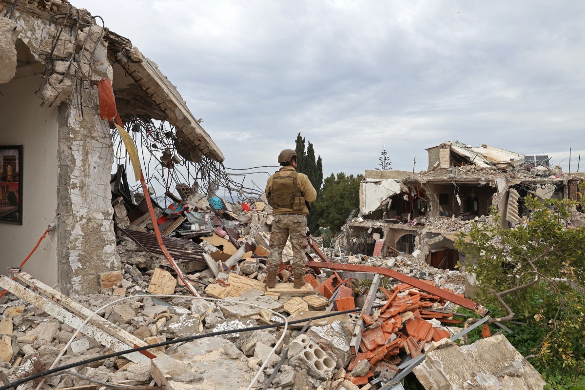 Photo used for representational purposes. A Lebanese soldier stands guard in a residential area that was devastated by the war between Israel and Hezbollah, in the southern coastal town of Naqura, on the border with Israel on January 22, 2025. Photo by Anwar AMRO / AFP.