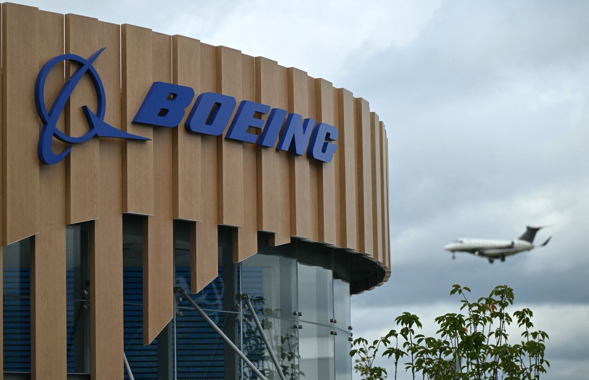 A logo is seen on the Boeing stand on the opening day of the Farnborough International Airshow 2024, south west of London, on July 22, 2024. Photo by JUSTIN TALLIS / AFP