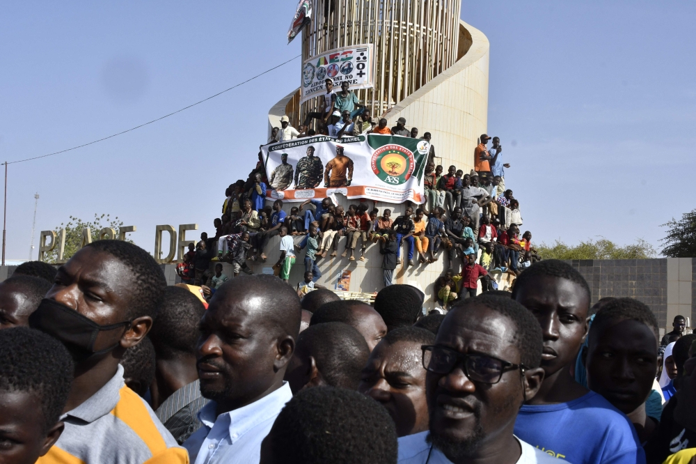 People gather to celebrate the withdrawal of Mali, Niger and Burkina Faso from the Economic Community of West African States (ECOWAS) in Niamey on January 28, 2025. (Photo by Boureima Hama / AFP)