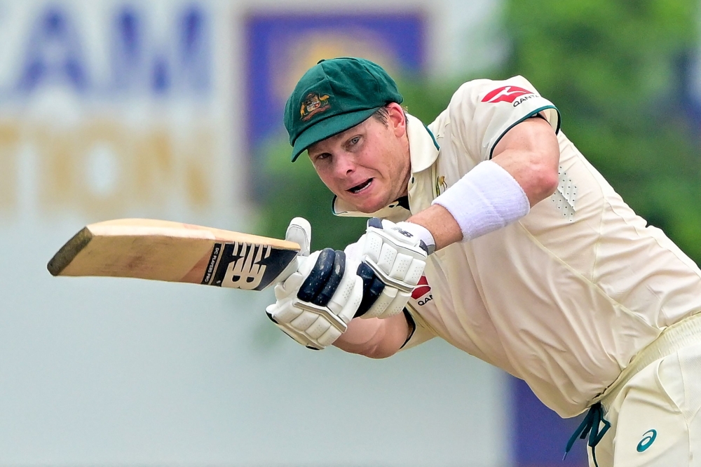 Australia's captain Steve Smith plays a shot during the first day of the first Test cricket match between Sri Lanka and Australia at the Galle International Cricket Stadium in Galle on January 29, 2025. (Photo by Ishara S. Kodikara / AFP)