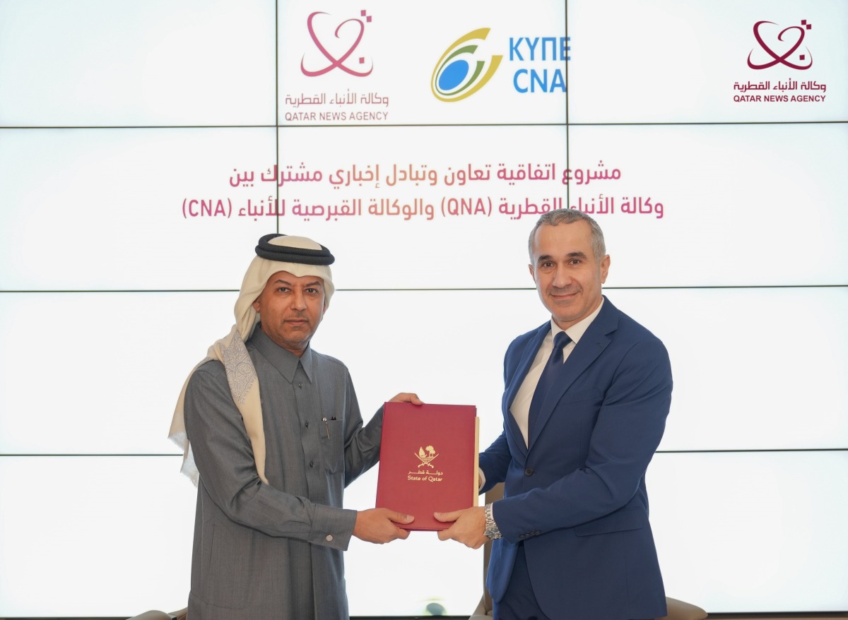 Director-General of QNA H E Ahmed bin Saeed Al Rumaihi and Chairman of CNA H E Andreas Frangos during the signing of the agreement.