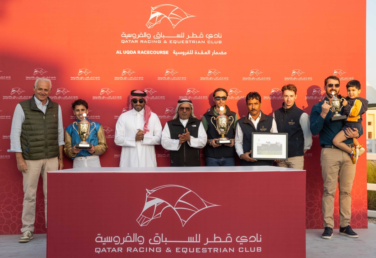 Doha Bu Thaila's connections celebrate after the Wathnan Racing-owned filly won the Al Waab Cup yesterday. Qatar Racing and Equestrian Club Racing Manager Abdulla Rashid Al Kubaisi honoured the winners. PICTURES: JUHAIM/QREC