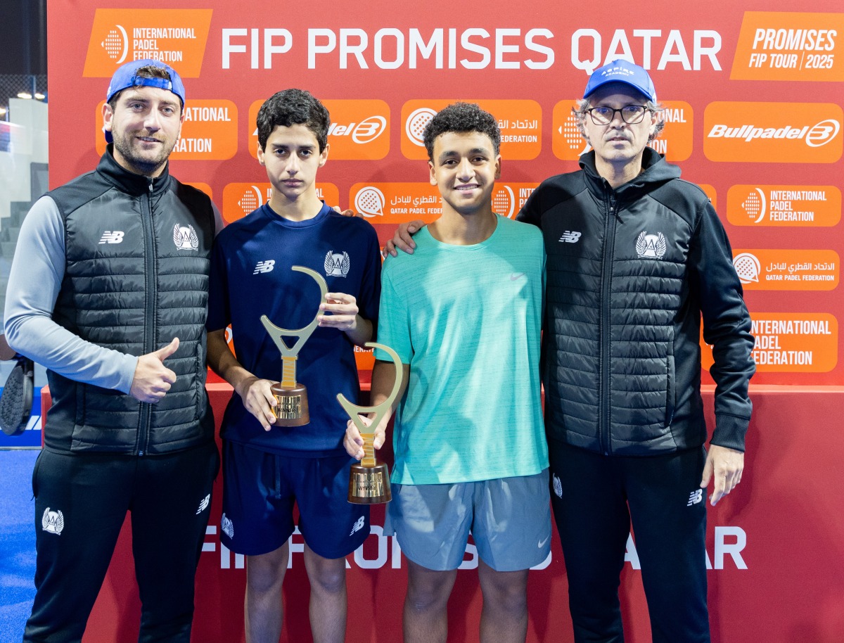 Victorious Aspire Academy players pose for a photo with officials.