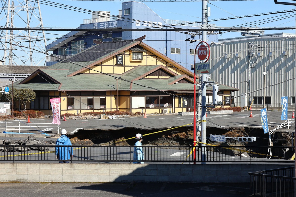 This photo shows a general view of a collapsed road at a prefectural road intersection, in the city of Yashio, Saitama Prefecture on January 30, 2025. Photo by JIJI Press / AFP