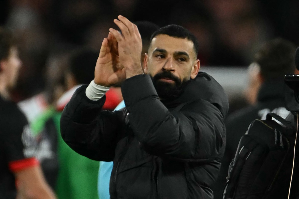 Liverpool's Egyptian striker #11 Mohamed Salah applauds fans after the English Premier League football match between Bournemouth and Liverpool at the Vitality Stadium in Bournemouth, southern England on February 1, 2025. Liverpool won the game 2-0. (Photo by Glyn KIRK / AFP) 