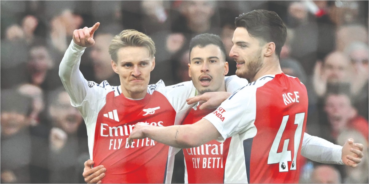 Martin Odegaard (left) celebrates with teammates after scoring Arsenal’s opening goal. 