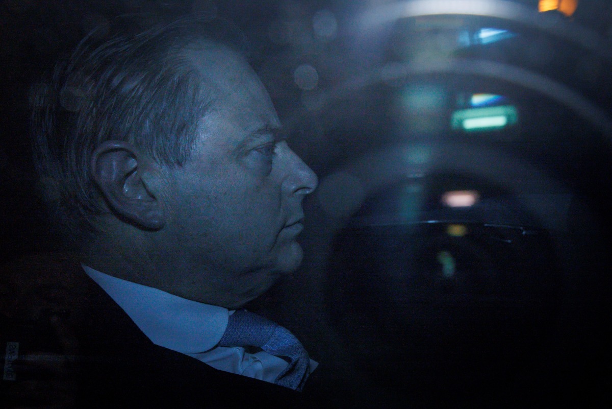 N-VA chairman Bart De Wever is seen behind a window as he arrives in his car for a meeting with King Filip of Belgium to discuss the negotiations to form a federal government at the Royal Palace in Brussels on January 31, 2025. Photo by Simon Wohlfahrt / AFP.