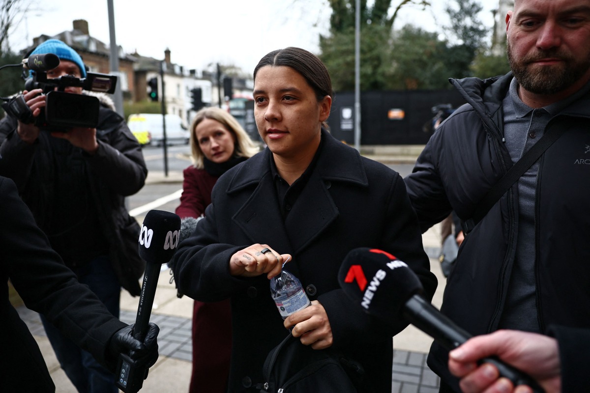 Chelsea's Australian striker Sam Kerr reacts as she arrives at Kingston Crown Court in south London on February 3, 2025, for the start of her trial. (Photo by HENRY NICHOLLS / AFP)
