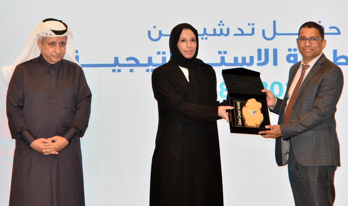 Minister of Social Development and Family H E Buthaina bint Ali Al Jabr Al Nuaimi presents a special memento to Shanvas Padiyath, Regional Manager of Lulu Qatar as Chairman of QCS Sheikh Dr. Khalid bin Jaber Al Thani looks on.