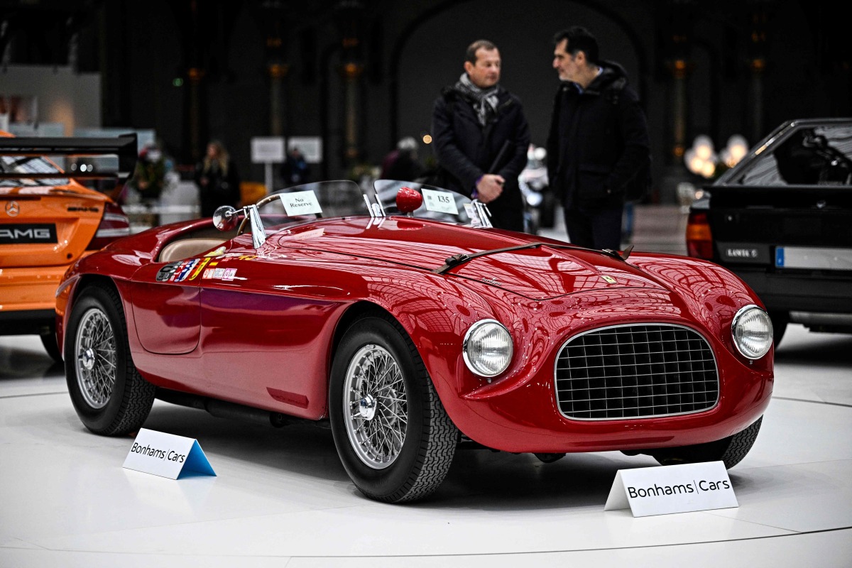 This photograph shows a 1950 Ferrari 166 MM Touring Barchetta during the press presentation of the exhibition 