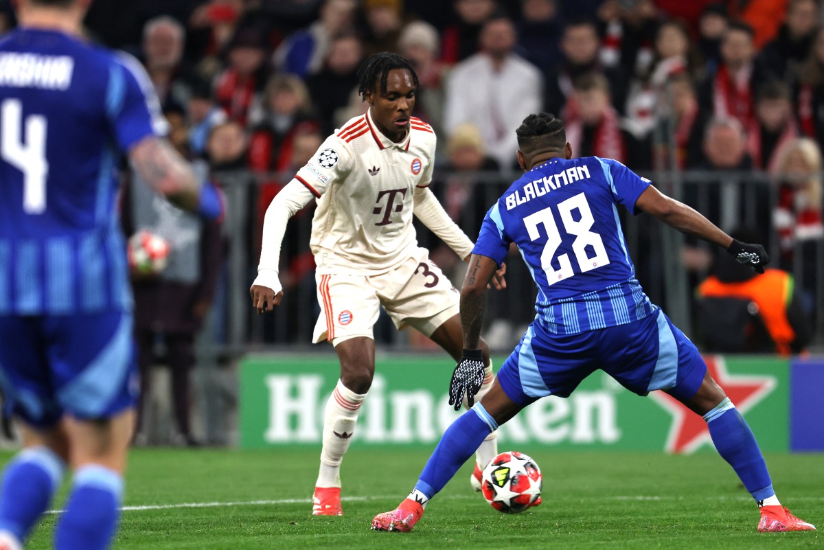 Bayern Munich's French forward #39 Mathys Tel and Slovan Bratislava's Panamanian defender #28 Cesar Blackman vie for the ball during the UEFA Champions League football match between FC Bayern Munich and SK Slovan Bratislava in Munich, southern Germany, on January 29, 2025. (Photo by Alexandra BEIER / AFP)
