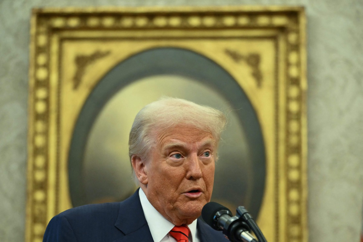 US President Donald Trump speaks before Pam Bondi is sworn in as US Attorney General in the Oval Office of the White House in Washington, DC, on February 5, 2025 (Photo by ANDREW CABALLERO-REYNOLDS / AFP)
