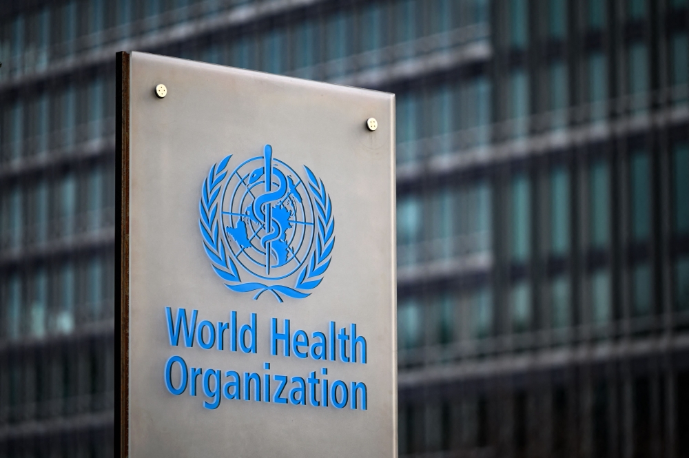 File: This photograph taken on December 7, 2021 shows a sign of the World Health Organisation (WHO) at their headquarters in Geneva. (Photo by Fabrice Coffrini / AFP)
