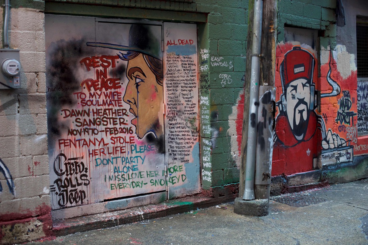 A mural in an alley in Vancouver's Downtown Eastside, on December 21, 2016, painted by a man mourning the fentanyl overdose death of his wife, with names of other victims of the crisis that killed 128 people in British Columbia in November. AFP / Deborah