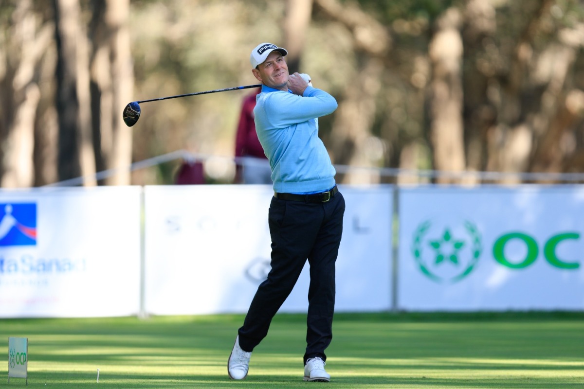 Simon Griffiths of England plays a shot during the first round.