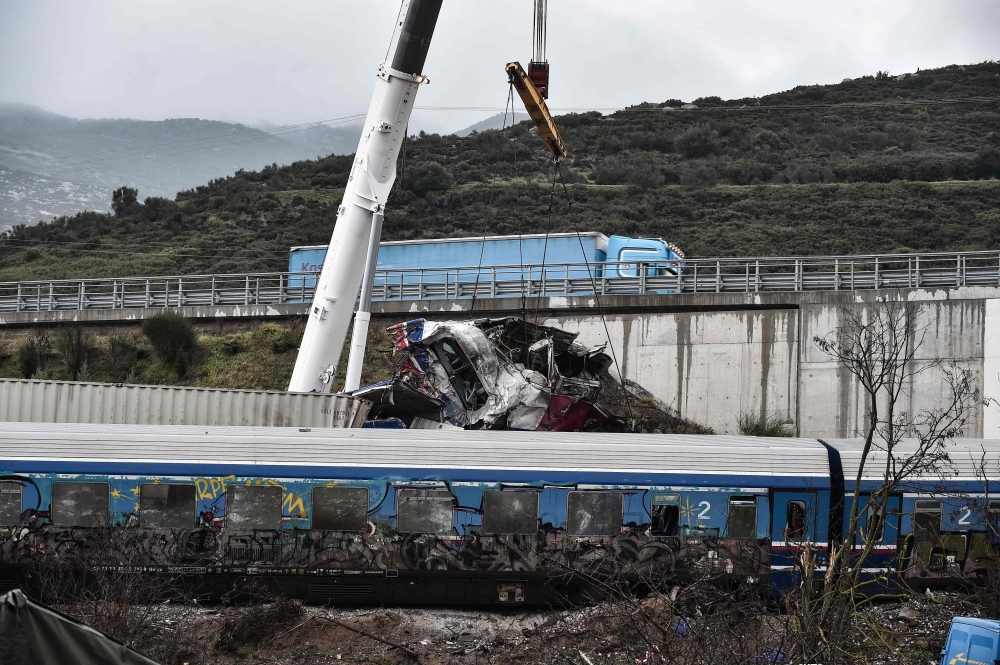 Search operations are underway after a head-on collision of a freight train with a passenger train carrying over 350 people killed dozens of people on February 28, the country's worst-ever rail disaster, in the Tempi Valley near Larissa on March 2, 2023. (Photo by Sakis MITROLIDIS / AFP)

