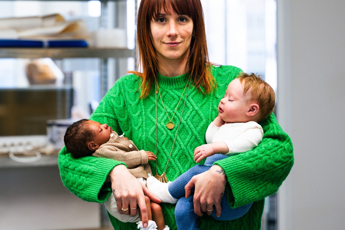 (Files) Co-Owner and Commercial Director of Cinebebe and Studio Junon Justine Ray Le Solliec poses with fake babies created by Cinebebe (Cinebaby) in Saint-Denis, suburbs of Paris, on January 24, 2025. (Photo by Julie Sebadelha / AFP)