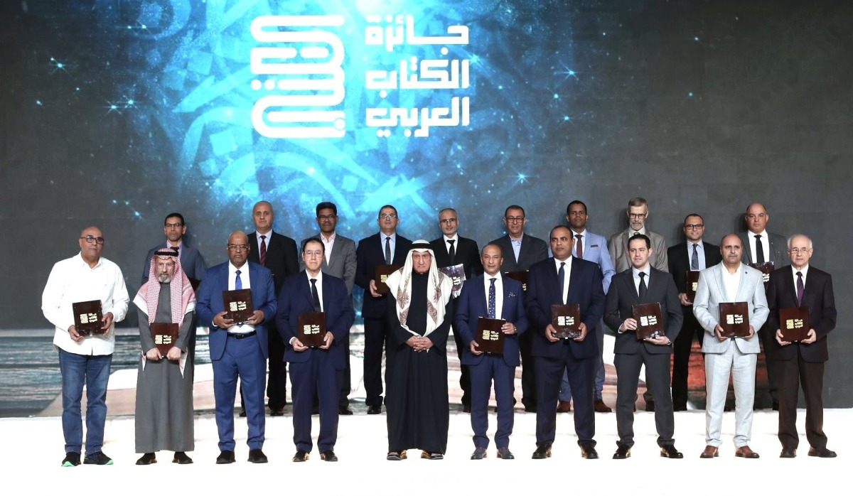 Secretary-General of the Arab Book Award Dr. Hassan Al Naama with winners during the ceremony.