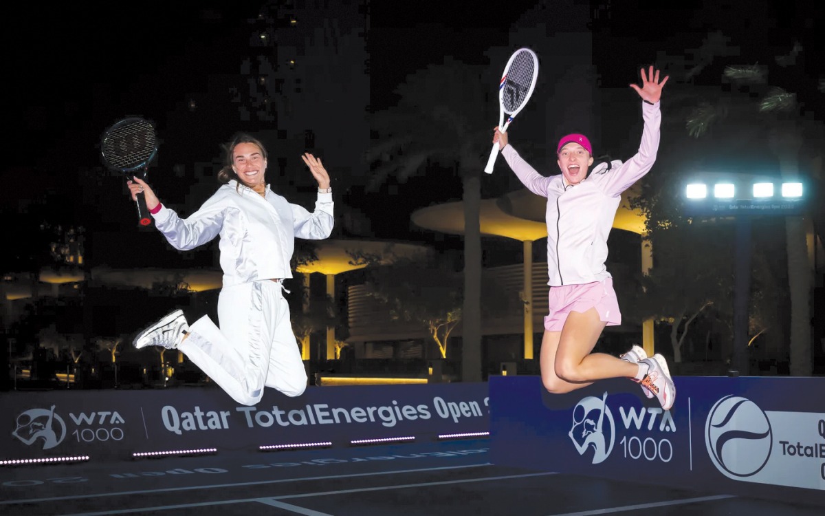 Belarusian Aryana Sabalenka (left) and Poland's Iga Swiatek during a promotional event in Doha.