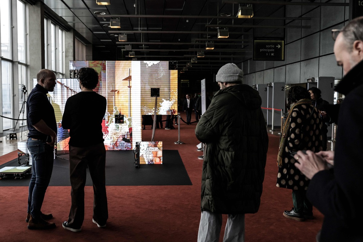 A general view shows the exhibitors' lounge during a cultural weekend in conjunction with the Summit for Action on Artificial Intelligence at the BNF (Bibliothèque natvionale François Miterrand) in Paris, on February 8, 2025. (Photo by Thibaud MORITZ / AFP)