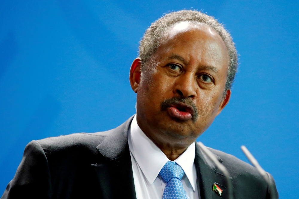 Sudan's Prime Minister Abdalla Hamdok and German Chancellor Angela Merkel (not pictured) address the media at the Chancellery in Berlin, Germany, February 14, 2020. REUTERS/Hannibal Hanschke/File Photo