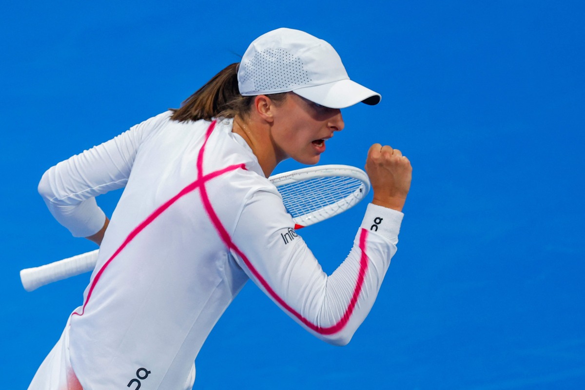 Iga Swiatek of Poland reacts after scoring a point against Maria Sakkari of Greece. AFP