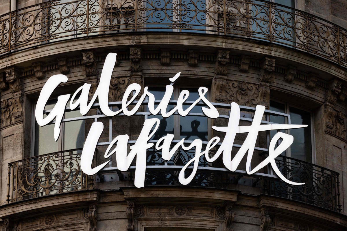 This photograph taken on December 15, 2024 shows the logo of the Galeries Lafayette displayed on a building in Paris. Photo by JOEL SAGET / AFP