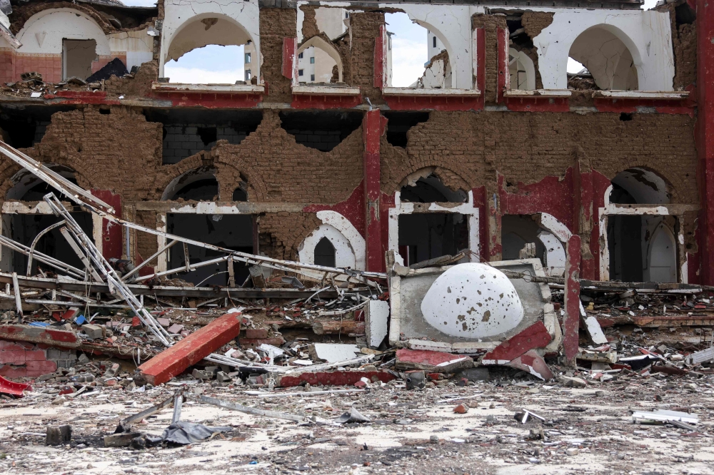 This picture shows the former restaurant area of the now heavily damaged Deira Hotel in western Gaza City, on February 11, 2025, amid the current ceasefire deal. (Photo by Bshar Taleb / AFP)