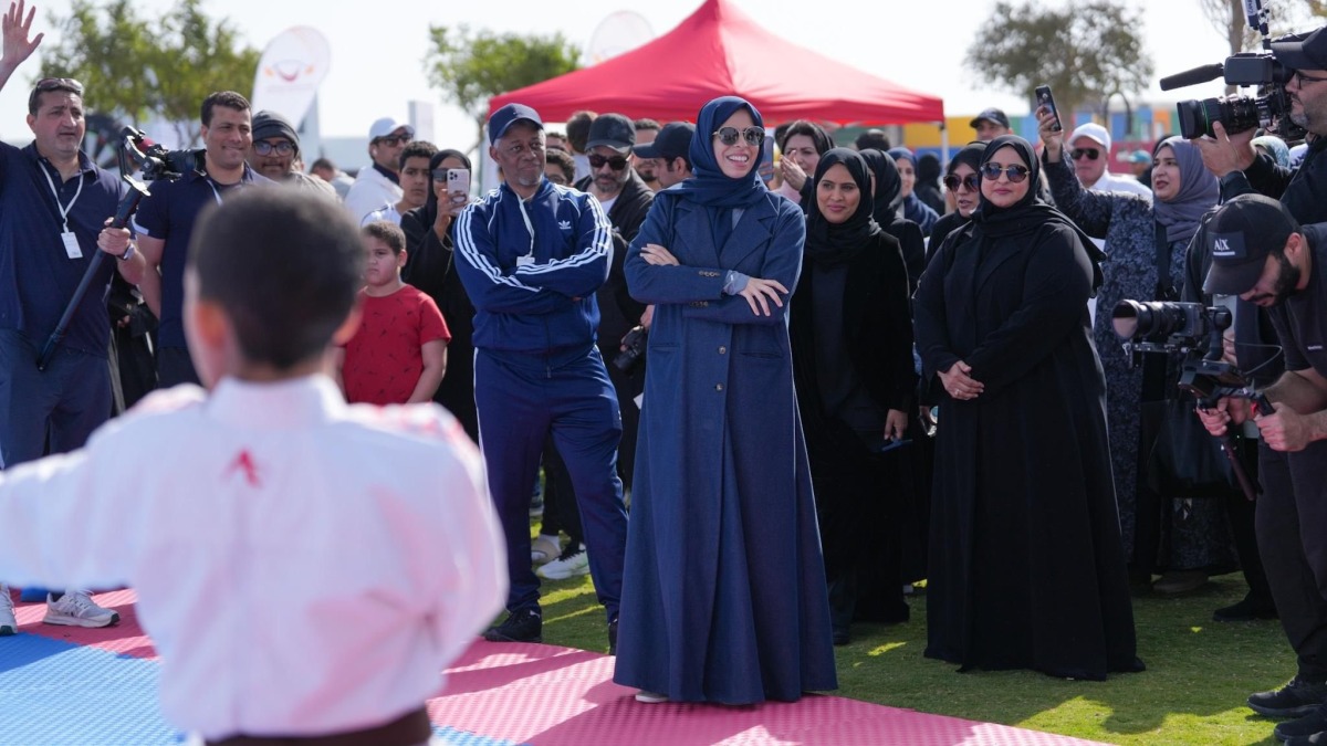 Minister of Education and Higher Education H E Lolwah bint Rashid Al Khater interacts with participants of NSD events at Old Doha Port Park yesterday.