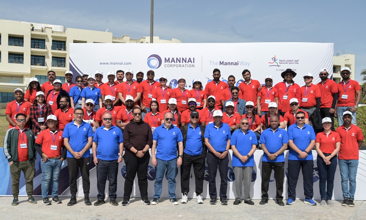 Mannai Corp senior managers with employees and volunteers on National Sport Day yesterday.