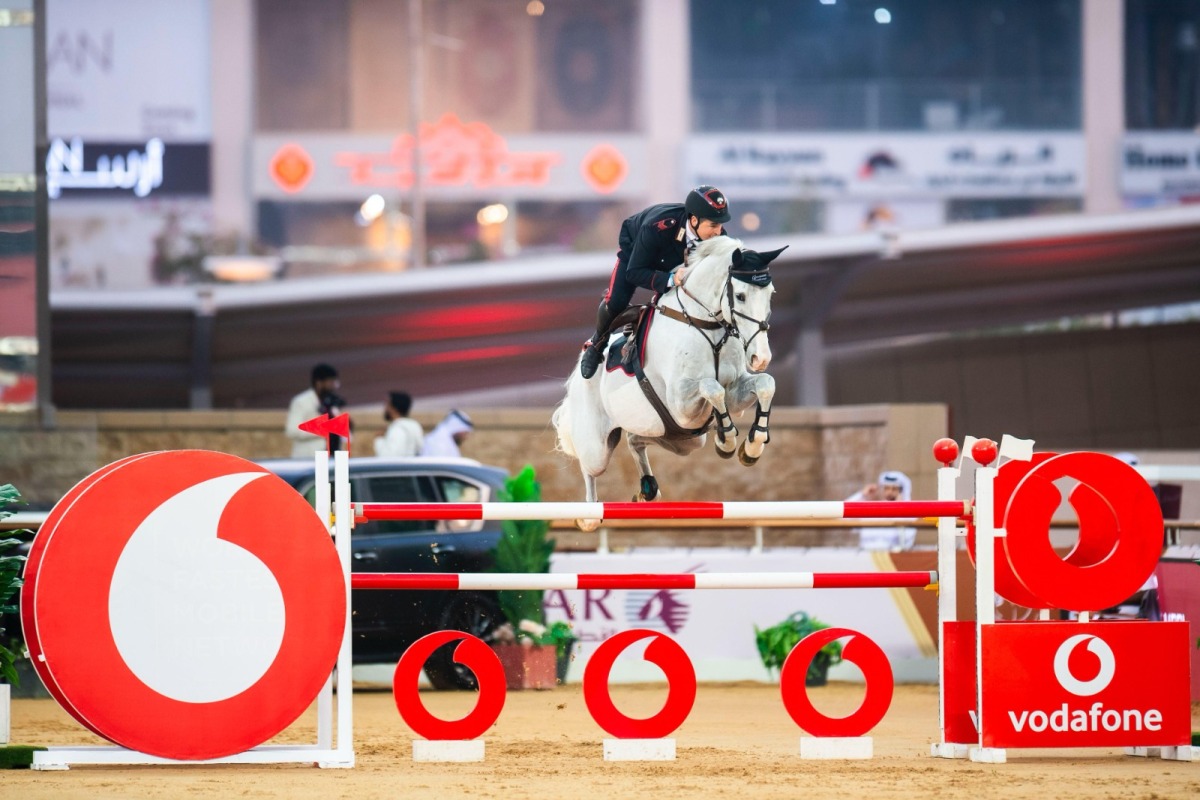 Italy's Emanuele Gaudiano astride grey gelding Chalou's Love PS clears a rail.