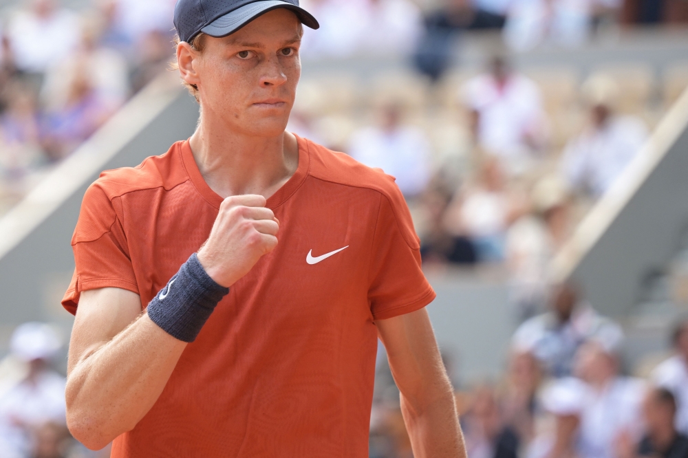 (Files) Italy's Jannik Sinner reacts after a point during his men's singles quarter final match at the Roland Garros Complex in Paris on June 4, 2024. (Photo by Bertrand Guay / AFP)
 